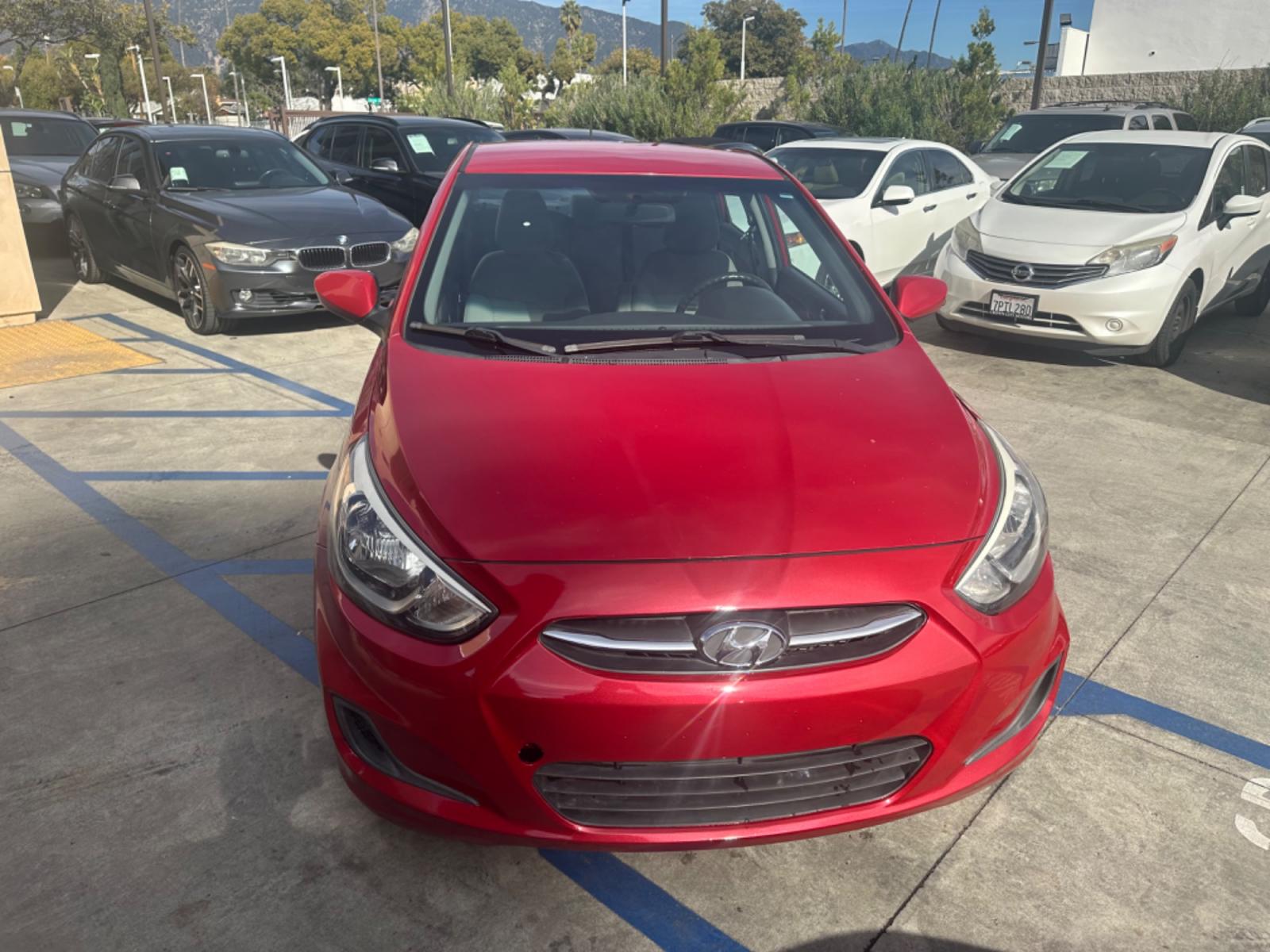 2015 Red /Gray Hyundai Accent GLS Sedan 4D (KMHCT4AE2FU) with an 4-Cyl, 1.6L engine, Auto, 6-Spd w/Overdrive transmission, located at 30 S. Berkeley Avenue, Pasadena, CA, 91107, (626) 248-7567, 34.145447, -118.109398 - The 2015 Hyundai Accent 4-Door Sedan stands as a testament to Hyundai's commitment to quality, efficiency, and value. Located in Pasadena, CA, our dealership specializes in providing a wide range of used BHPH (Buy Here Pay Here) cars, trucks, SUVs, and vans, including the remarkable Hyundai Accent. - Photo #7